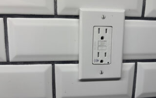 Older two-prong electrical outlet in a Baltimore Maryland home
