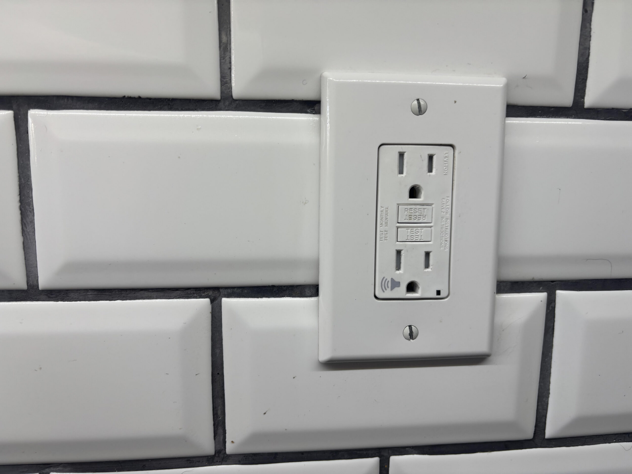 Older two-prong electrical outlet in a Baltimore Maryland home